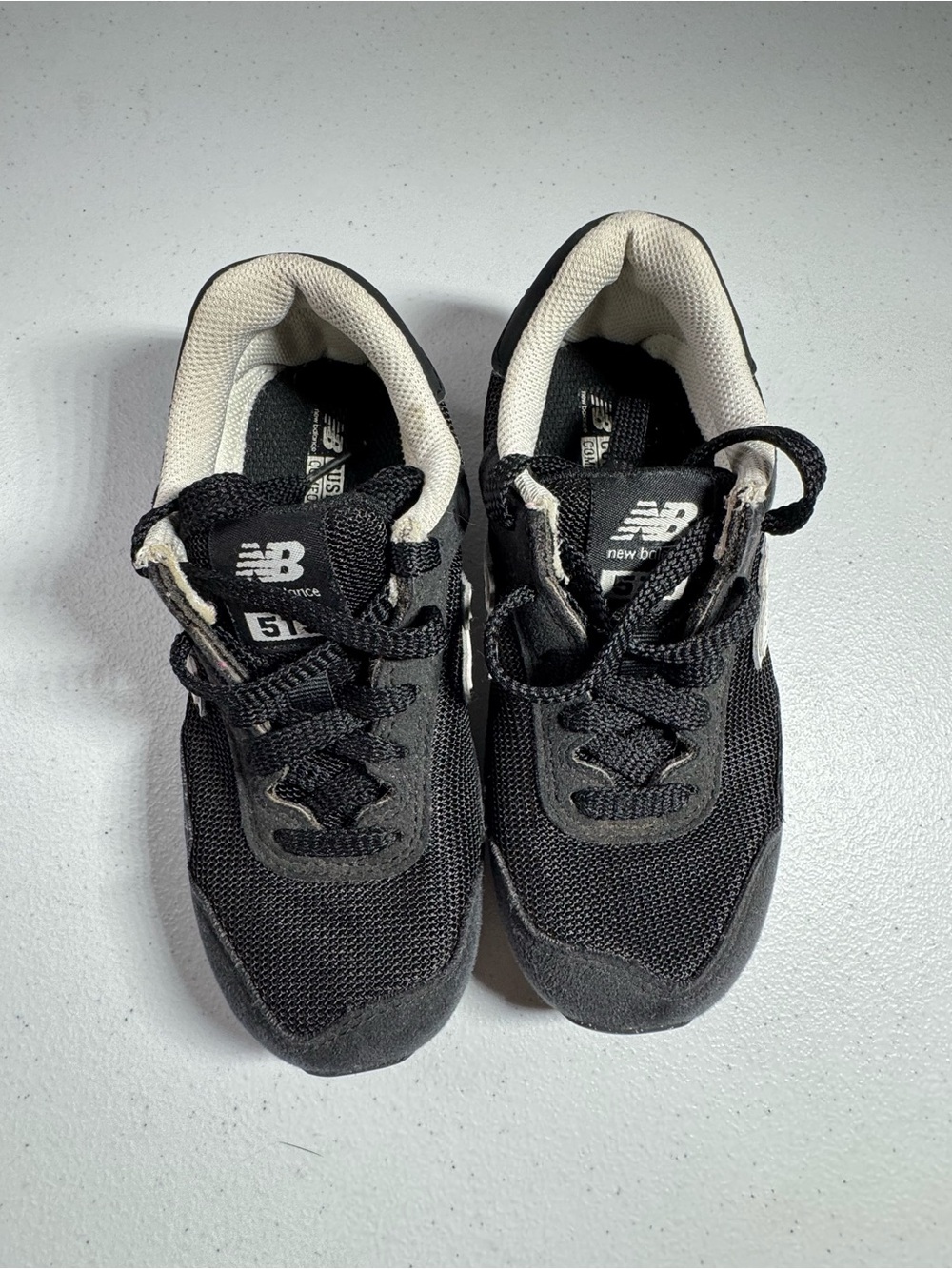 New Balance Kids Black and Cream Sneakers